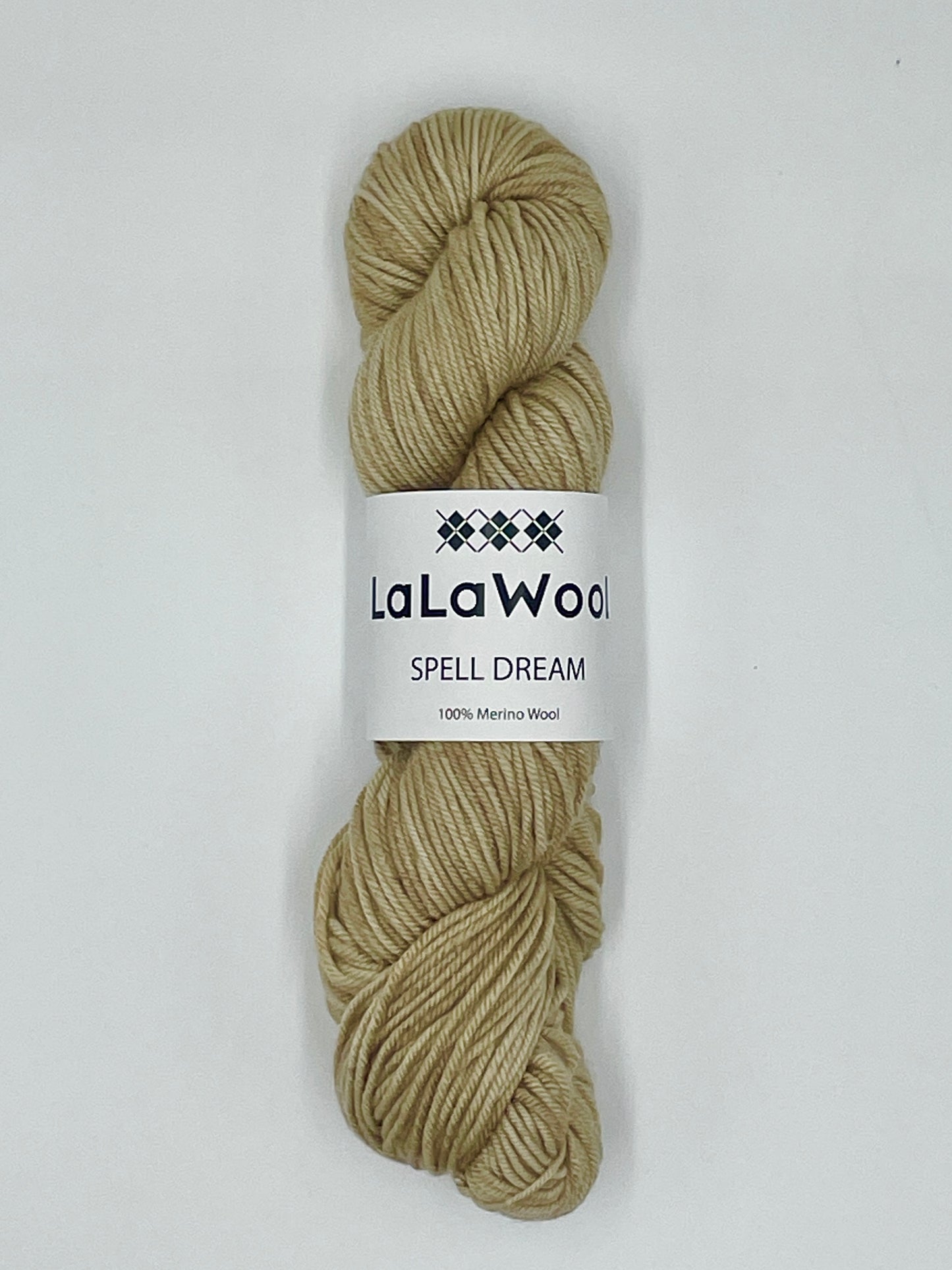 100% Australian Merino Spell Dream Worsted Yarn in Beige Oat Colour, top view of one skein with LaLaWool tag