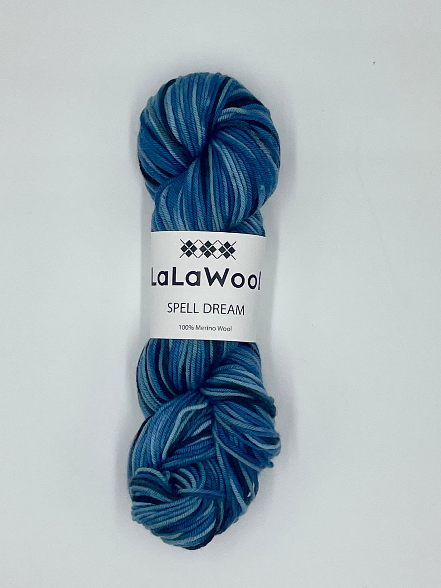 100% Australian Merino Spell Dream Worsted Yarn in Ocean Blue Colour, top view of one skein with LaLaWool tag