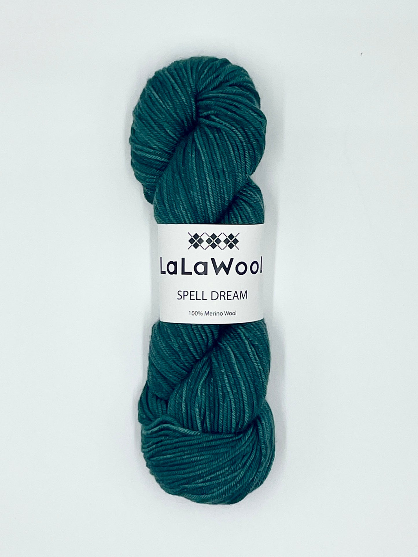 100% Australian Merino Spell Dream Worsted Yarn in Teal Green Colour, top view of one skein with LaLaWool tag