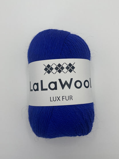 Angora Fingering Yarn Lux Fur in Cobalt Blue Colour, top view of one skein with LaLaWool tag, white background