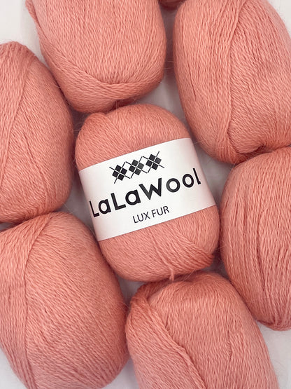 Angora Fingering Yarn Lux Fur in Peach Pink Colour, top view with multiple skeins with LaLaWool tag, white background