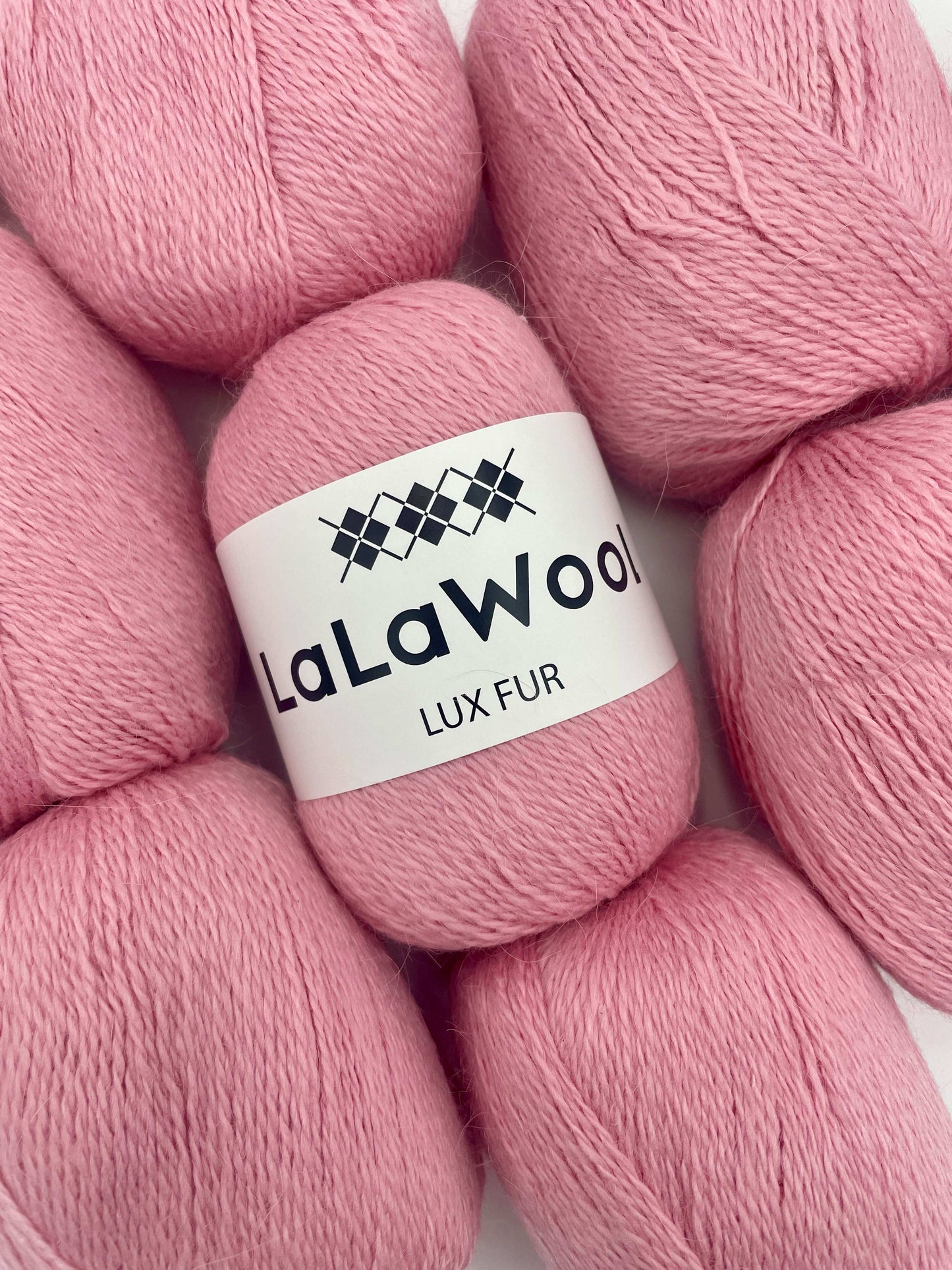 Angora Fingering Yarn Lux Fur in Cherry Blossom Pink Colour, top view with multiple skeins with LaLaWool tag, white background