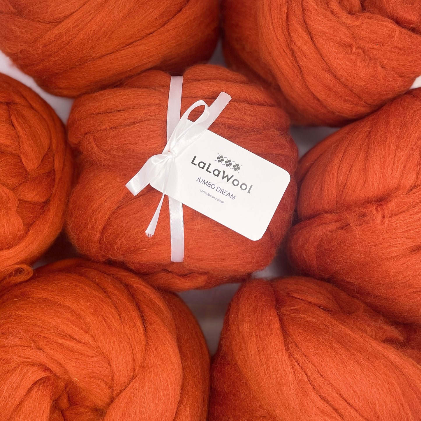 100% Australian Merino Chunky Jumbo Dream Blood Orange Yarn, top view with multiple balls
