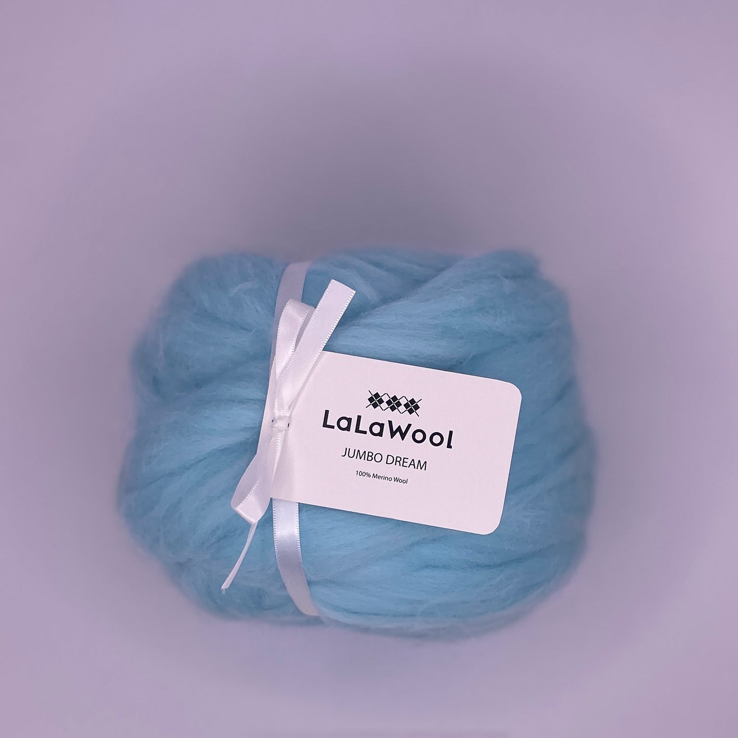 100% Australian Merino Chunky Jumbo Dream Blue Sky Yarn, single ball side view with tag