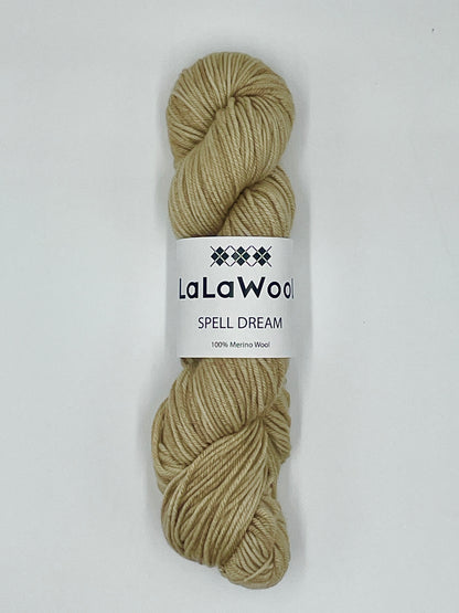 100% Australian Merino Spell Dream Worsted Yarn in Beige Oat Colour, top view of one skein with LaLaWool tag
