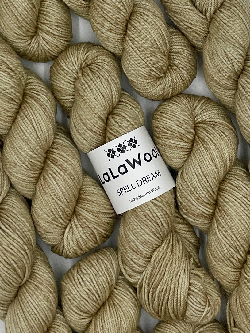 100% Australian Merino Spell Dream Worsted Yarn in Beige Oat Colour, top view with multiple skeins with LaLaWool tag