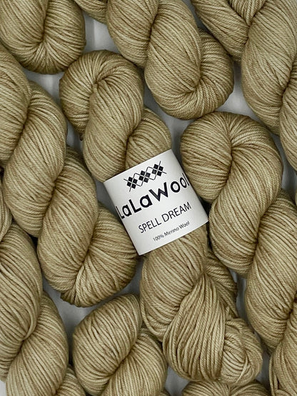 100% Australian Merino Spell Dream Worsted Yarn in Beige Oat Colour, top view with multiple skeins with LaLaWool tag