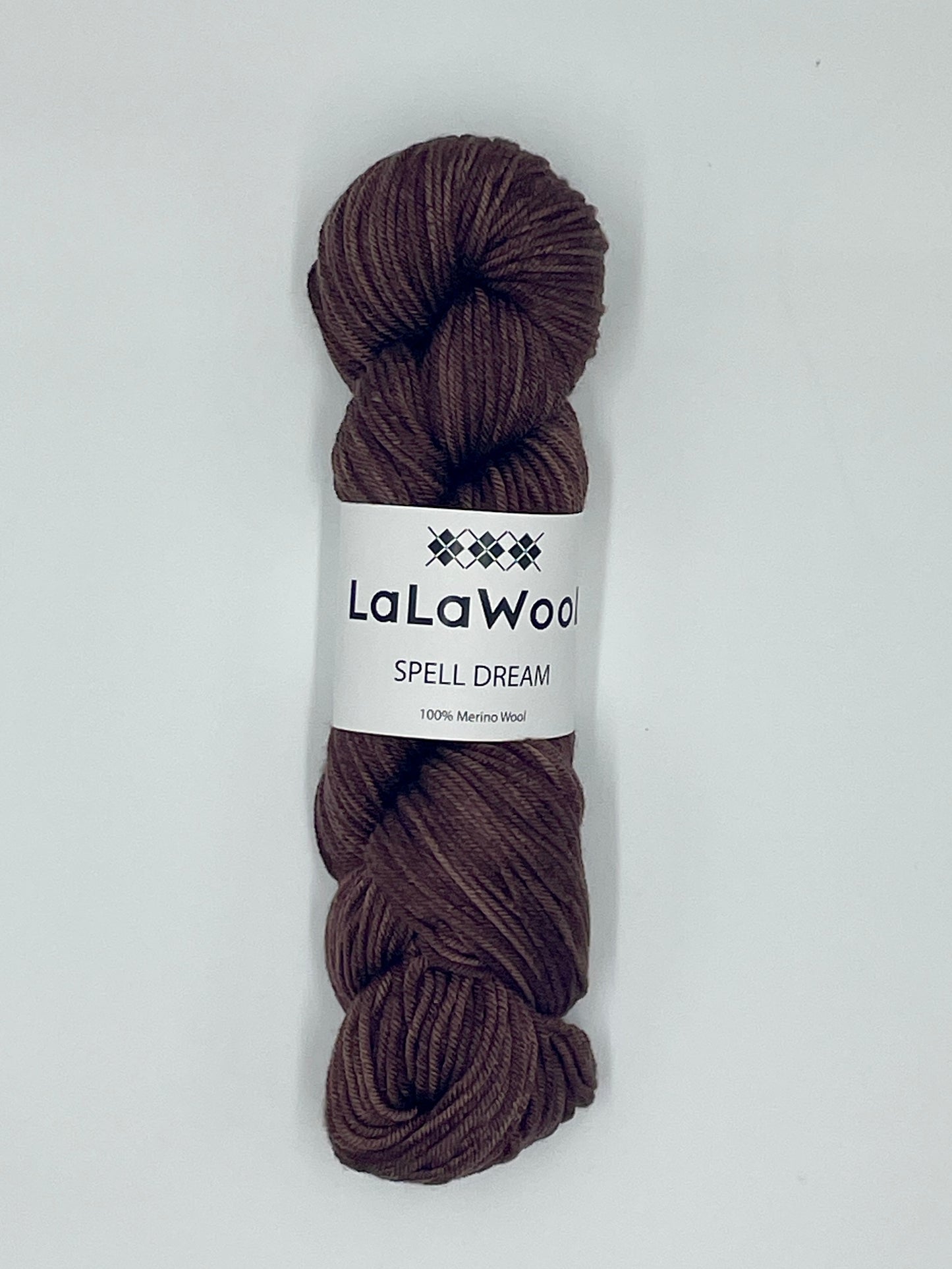 100% Australian Merino Spell Dream Worsted Yarn in Brown Cacao Colour, top view of one skein with LaLaWool tag