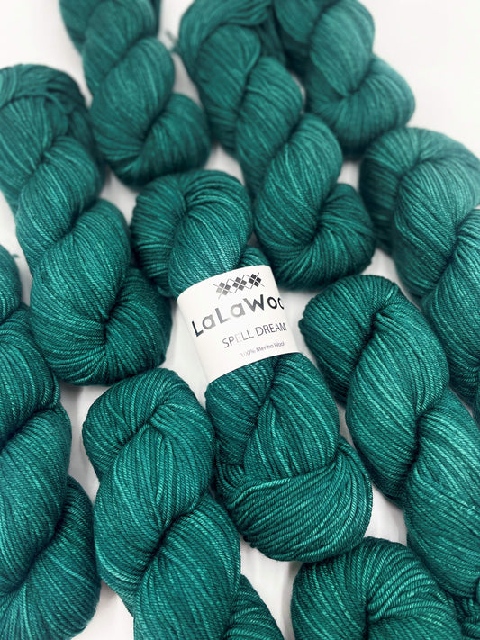 100% Australian Merino Spell Dream Worsted Yarn in Teal Green Colour, top view with multiple skeins with LaLaWool tag