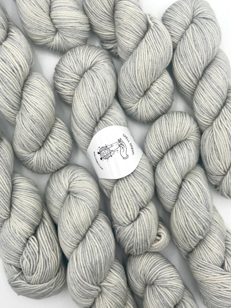 100% Australian Merino Spell Dream Worsted Yarn in Horizon Silver color, top view with multiple skeins with LaLaWool tag