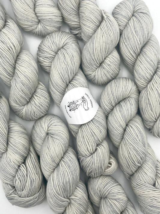 100% Australian Merino Spell Dream Worsted Yarn in Horizon Silver color, top view with multiple skeins with LaLaWool tag
