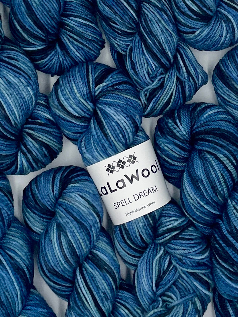 100% Australian Merino Spell Dream Worsted Yarn in Ocean Blue Colour, top view with multiple skeins with LaLaWool tag