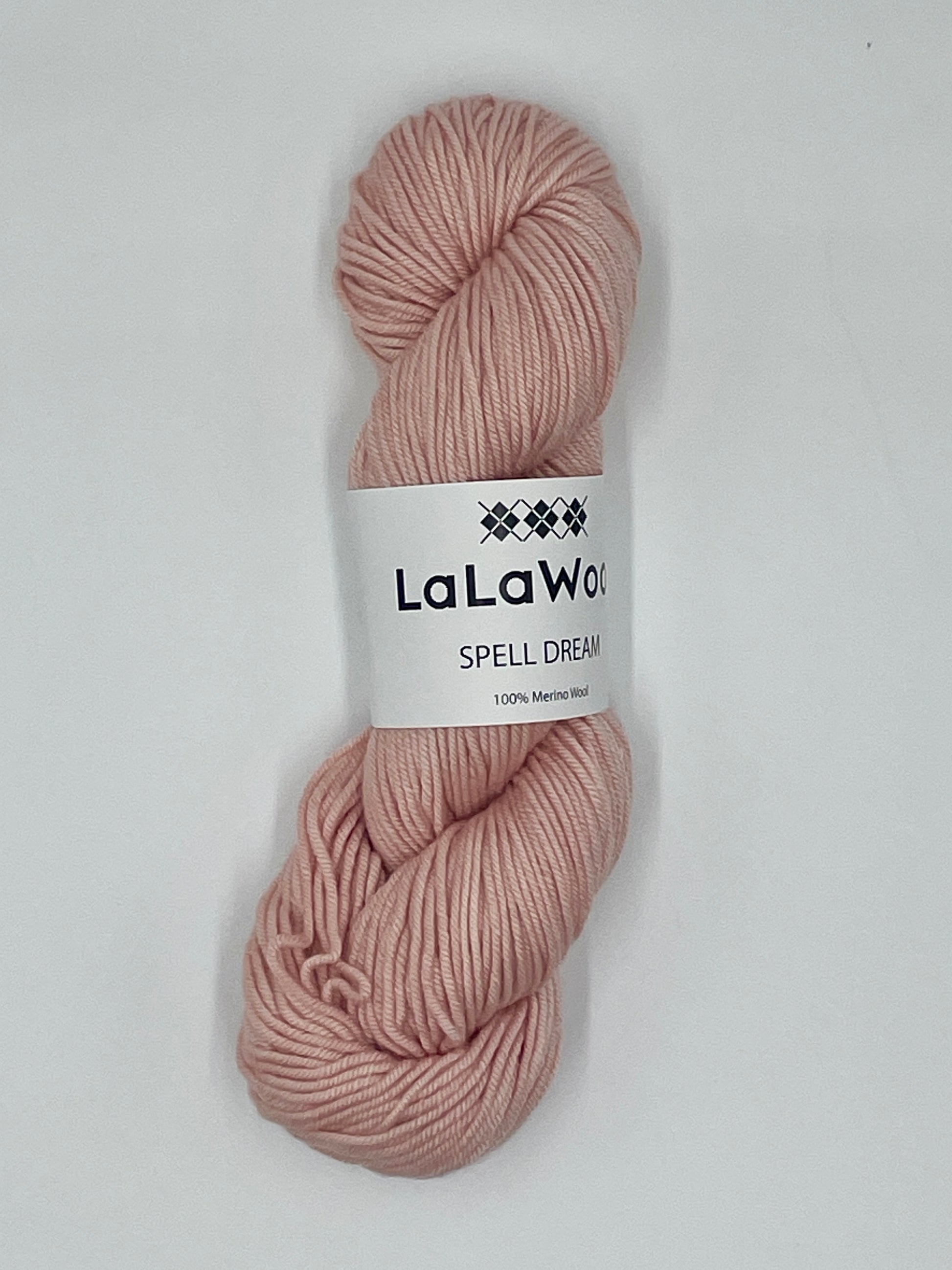 100% Australian Merino Spell Dream Worsted Yarn in Blush Pink Colour, top view of one skein with LaLaWool tag