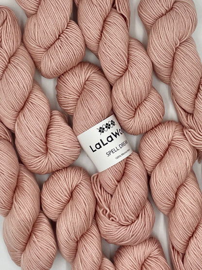 100% Australian Merino Spell Dream Worsted Yarn in Blush Pink Colour, top view with multiple skeins with LaLaWool tag