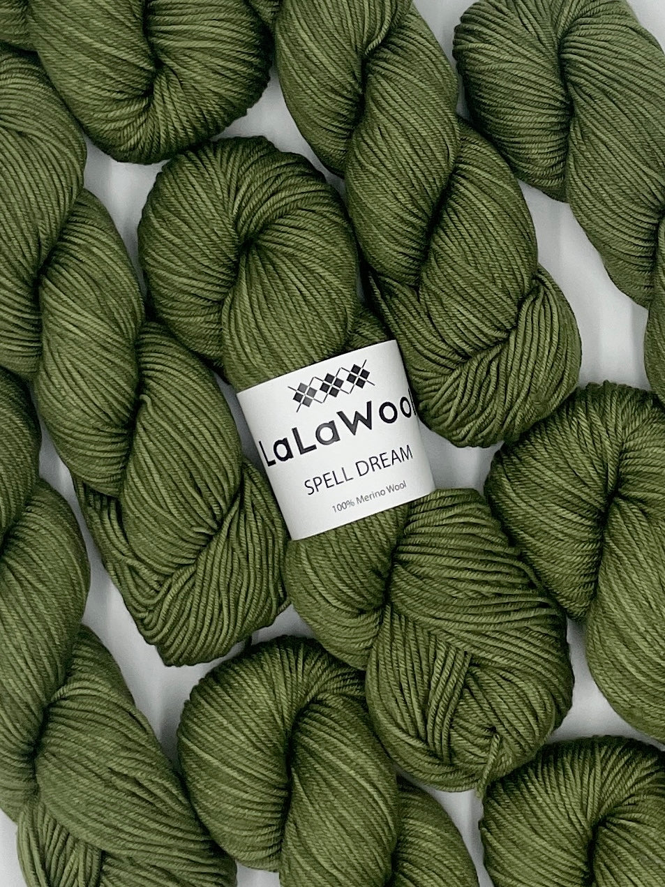 100% Australian Merino Spell Dream Worsted Yarn in Sage Green Colour, top view with multiple skeins with LaLaWool tag
